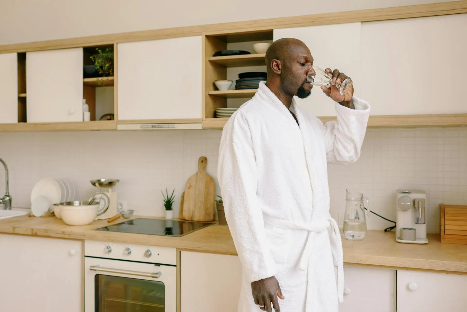 A man drinking water after taking a tribulus supplement