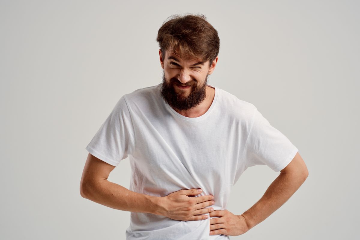 A man experiencing stomach pain.