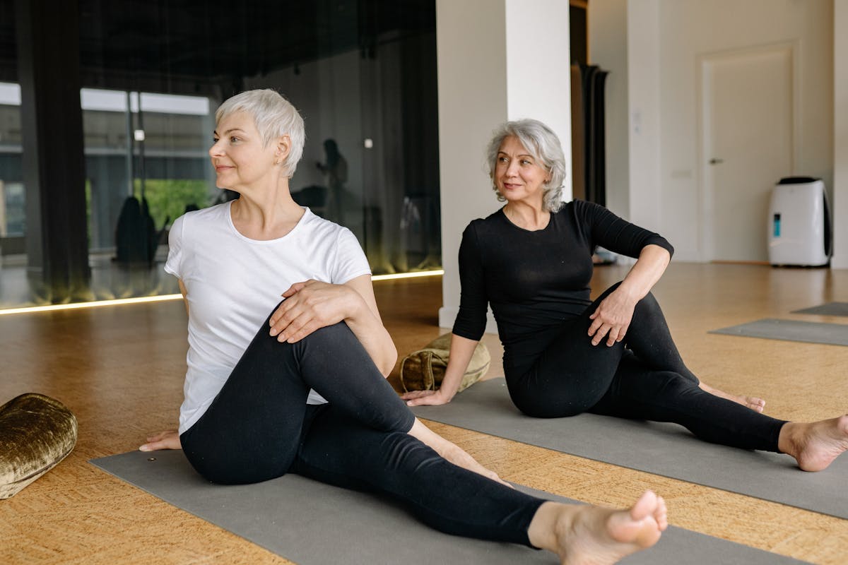 Elderly women stretching during yoga session