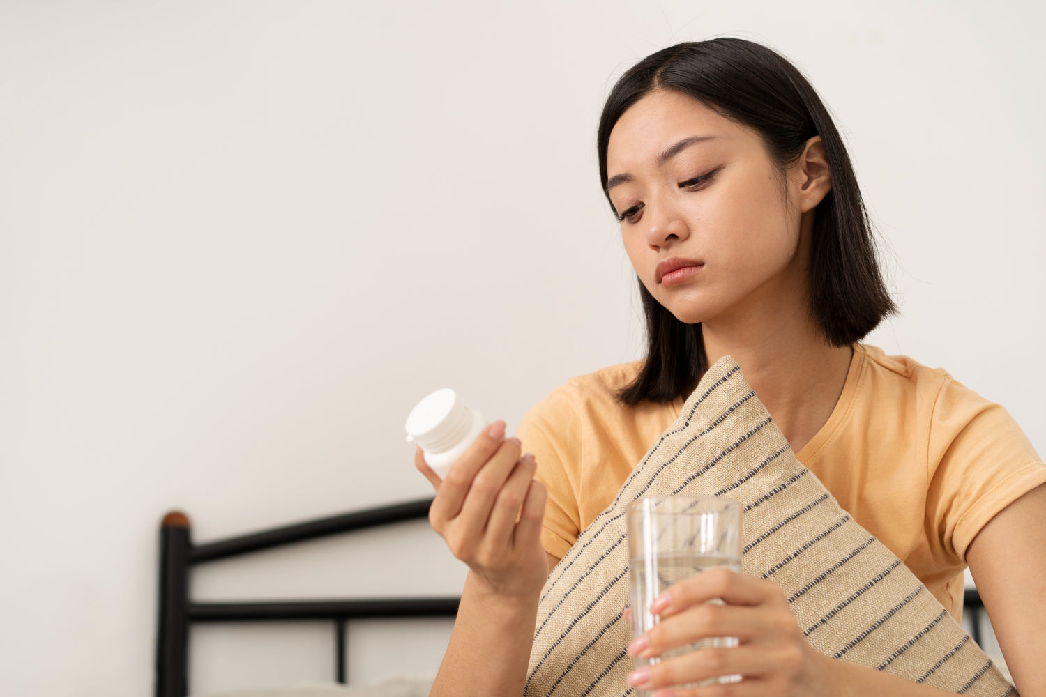 woman looking at supplement