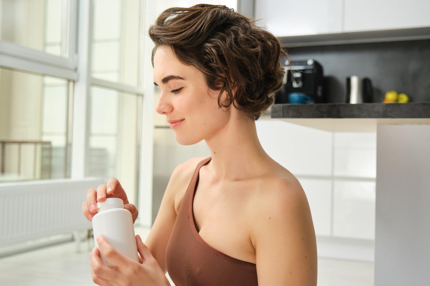 a woman taking supplement