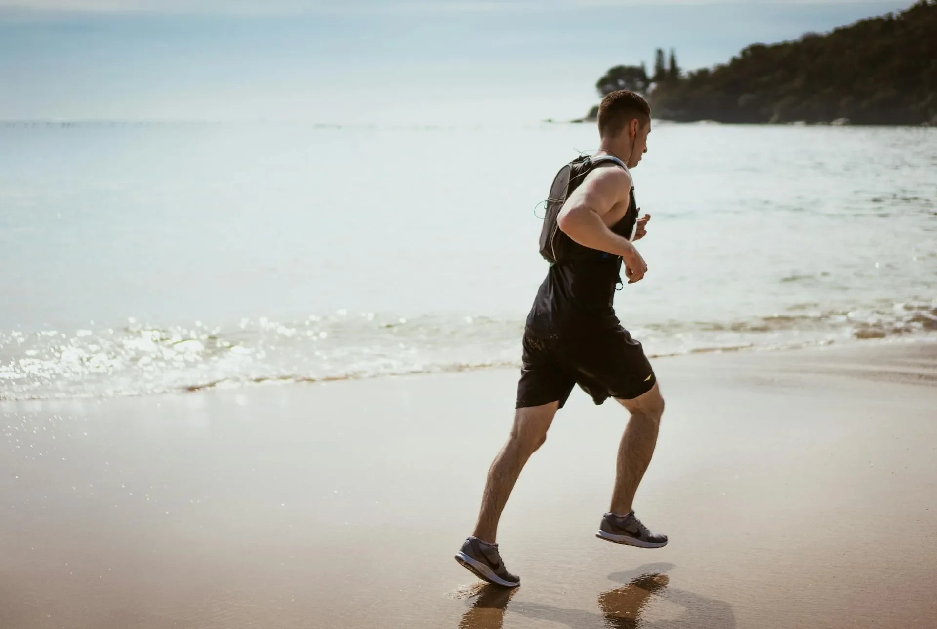 A man running beside the beach