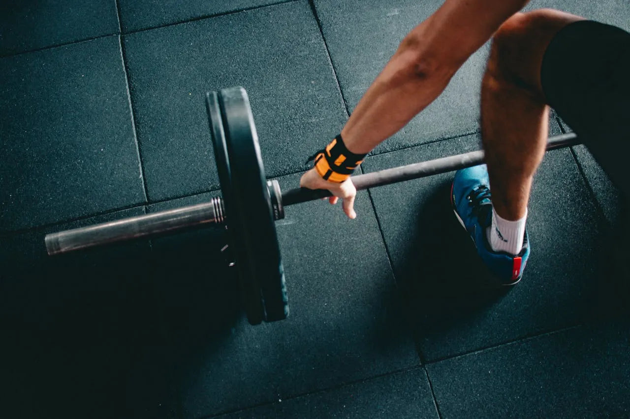 a man that is about to lift a barbell