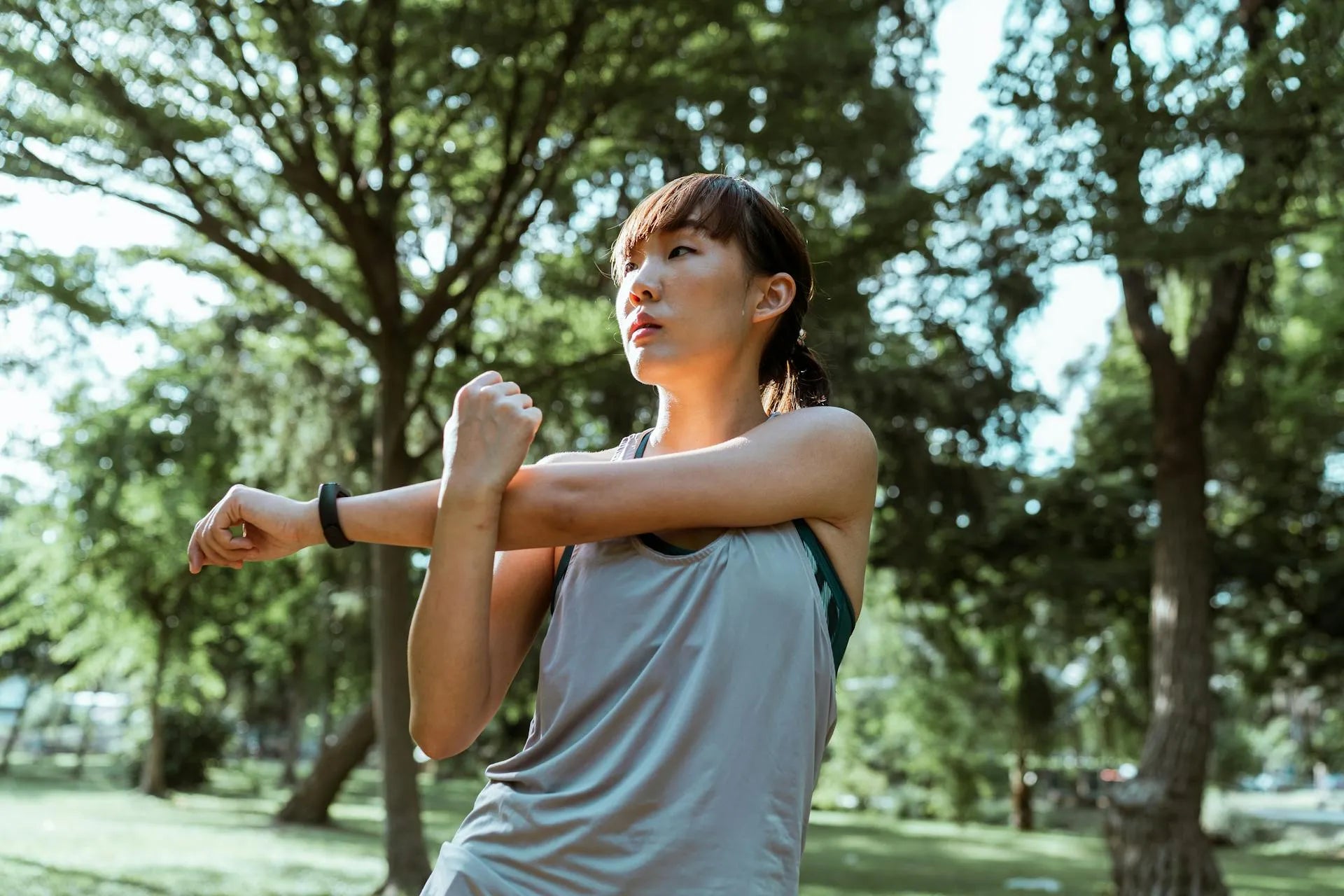 woman stretching her body before jogging